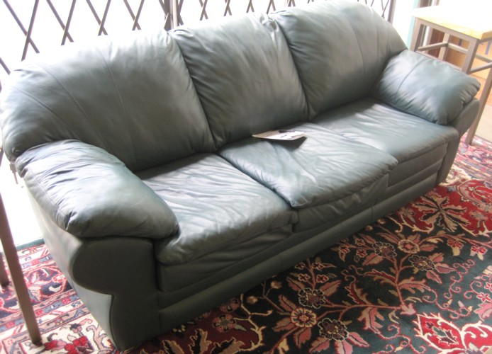 A CONTEMPORARY GREEN LEATHER SOFA