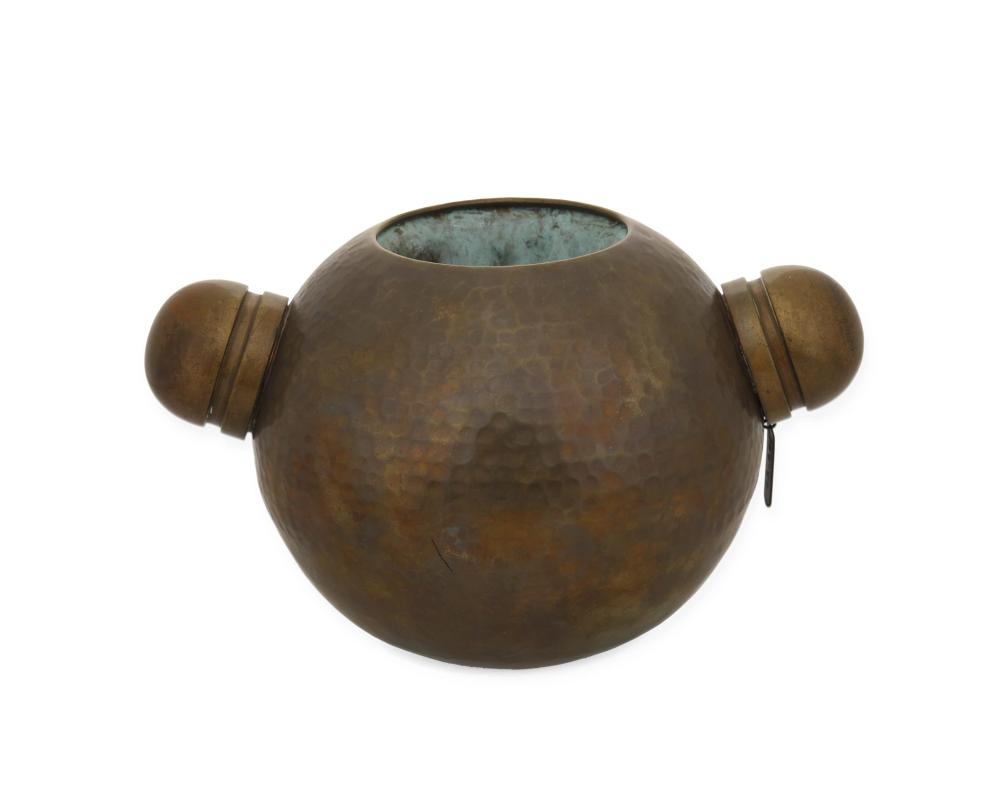 A CONTEMPORARY HAMMERED COPPER
