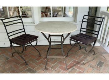A contemporary iron bistro set, two