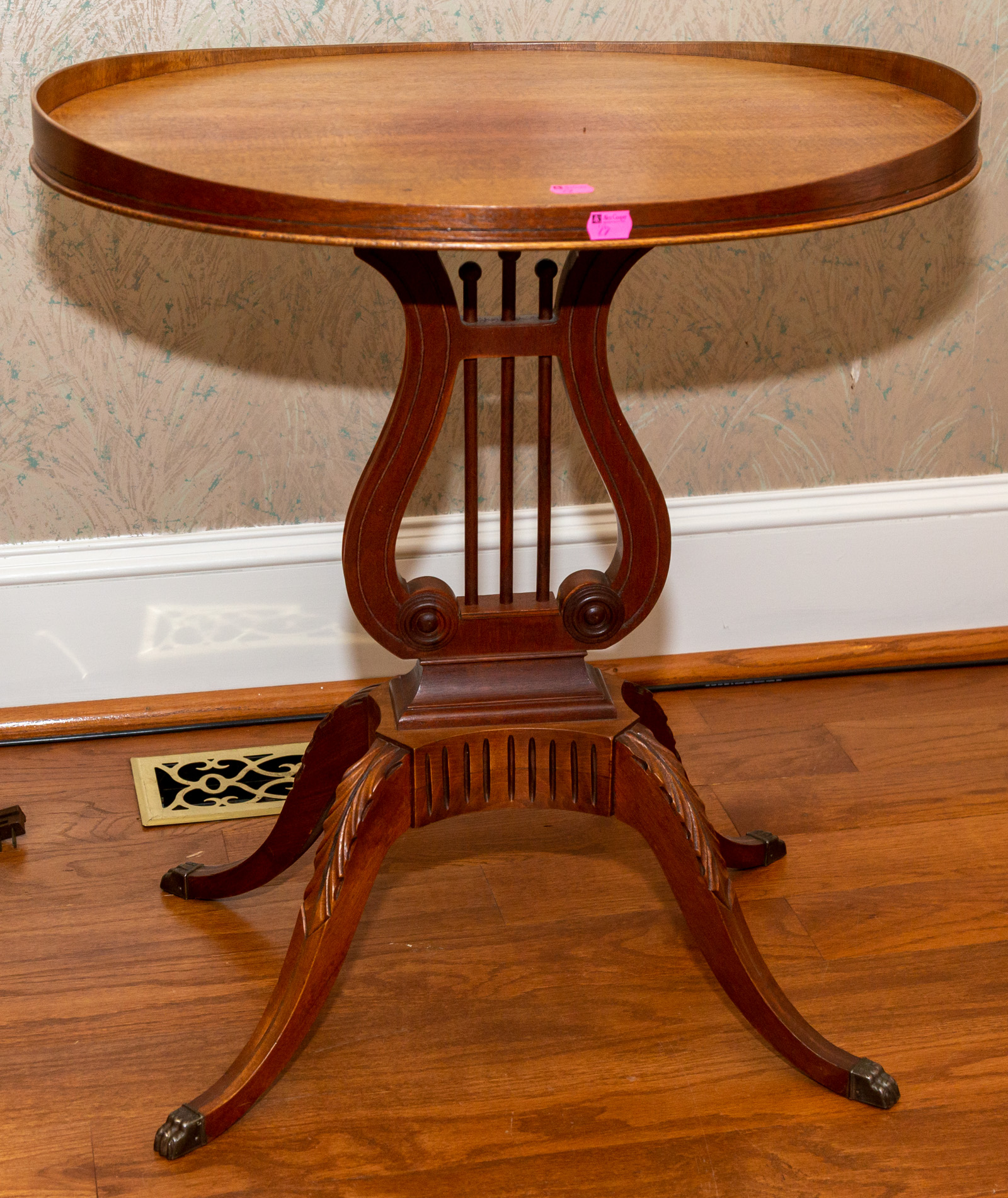 A CONTEMPORARY LYRE FORM SIDE TABLE