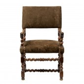 A CONTINENTAL CARVED ARM CHAIR