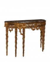 A CONTINENTAL CARVED GILTWOOD