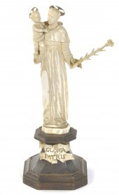 A Continental carved ivory fig