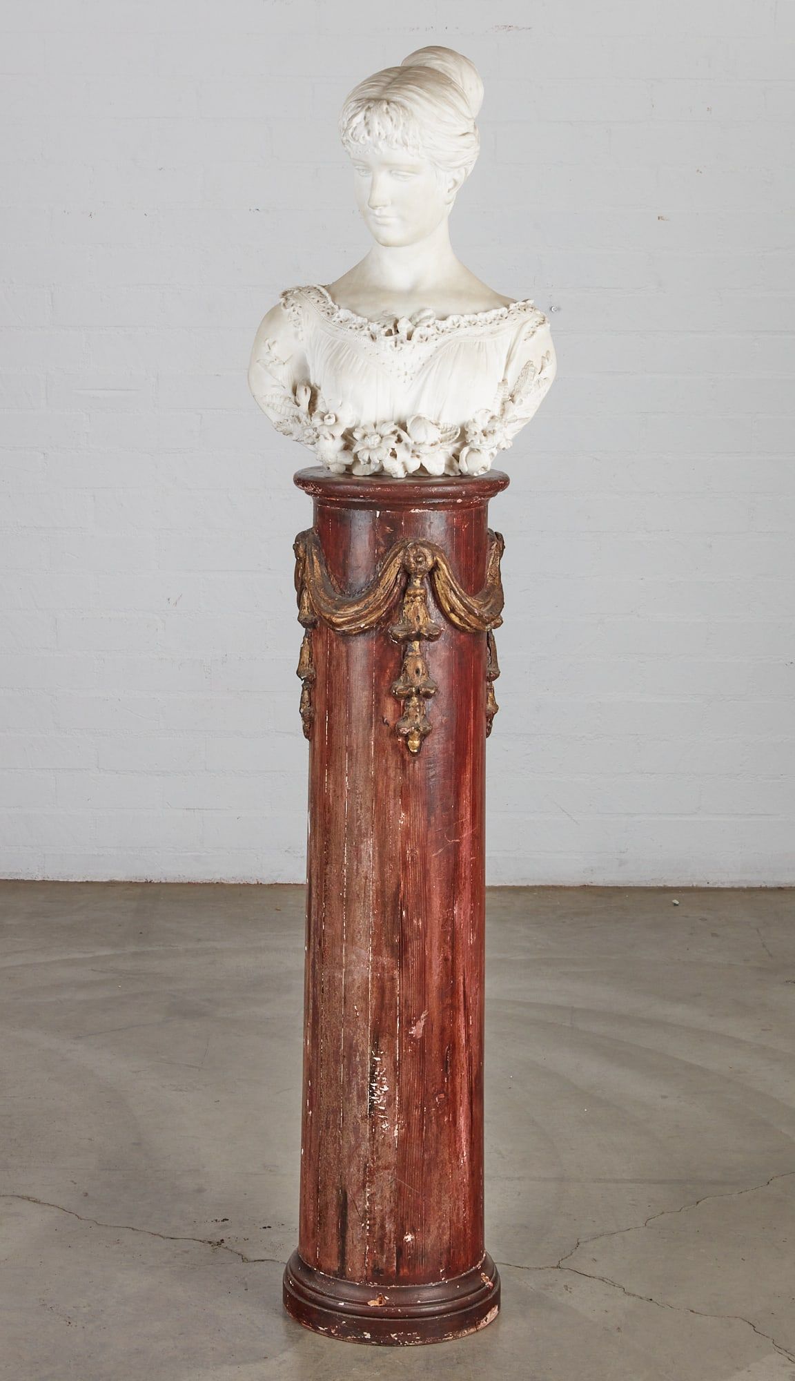 A CONTINENTAL CARVED MARBLE BUST OF