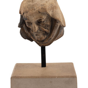 A Continental Carved Stone Head