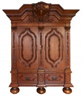 A CONTINENTAL CARVED TWO DOOR