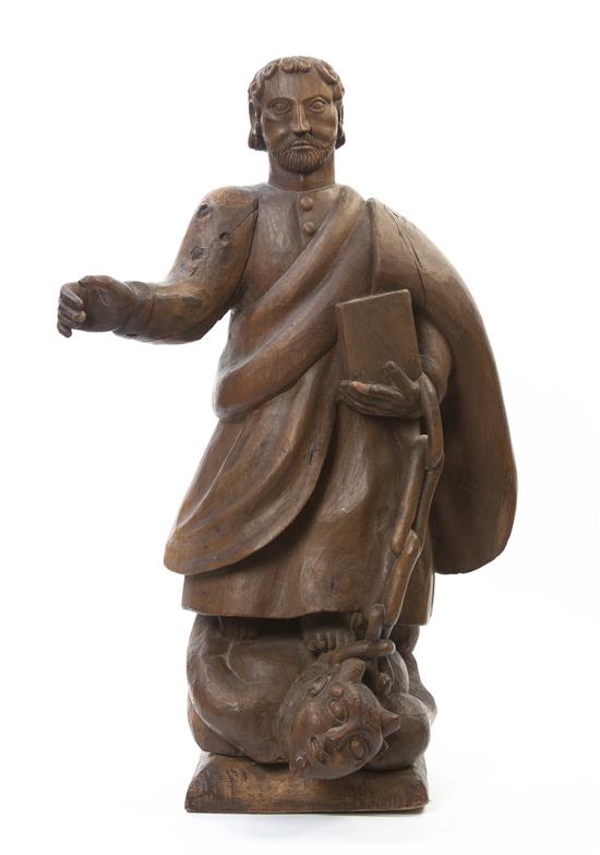 * A Continental Carved Wood Figural