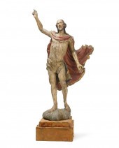 A CONTINENTAL CARVED WOOD FIGU