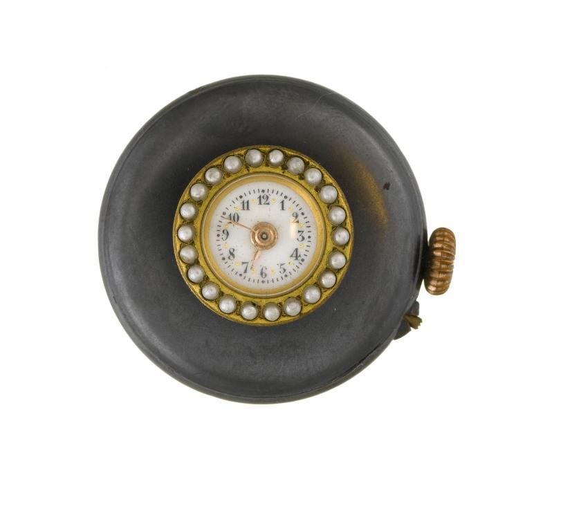 A CONTINENTAL GUNMETAL BUTTONHOLE