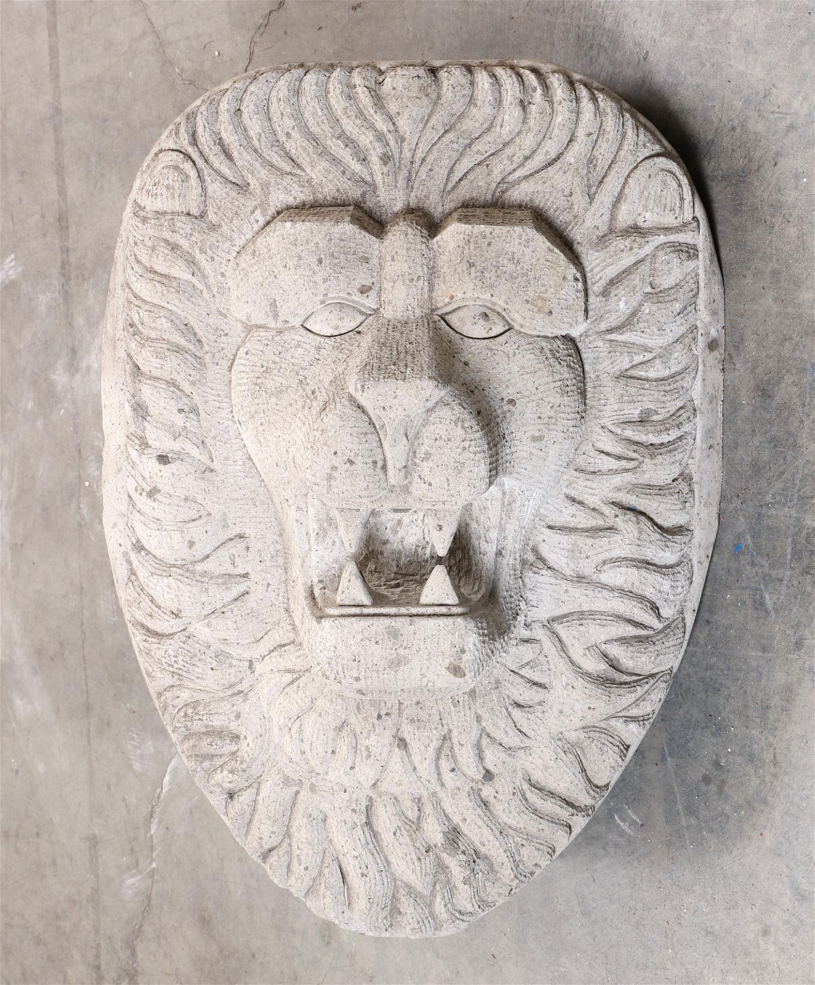 A CONTINENTAL LIMESTONE LION MASK