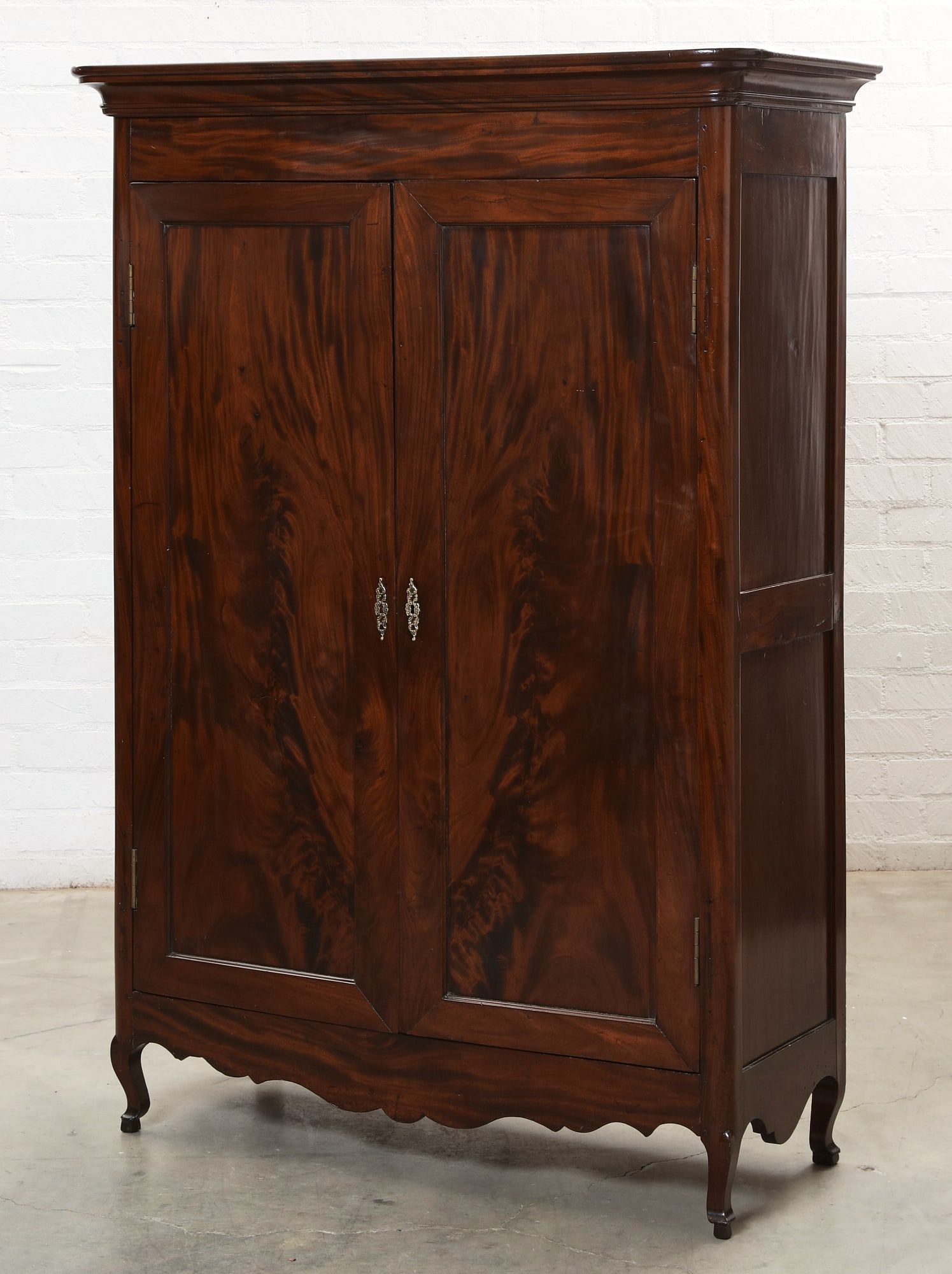 A CONTINENTAL MAHOGANY ARMOIREA