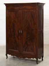 A CONTINENTAL MAHOGANY ARMOIRE