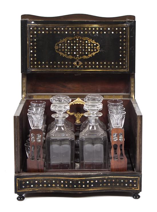 A Continental Mahogany Brass and