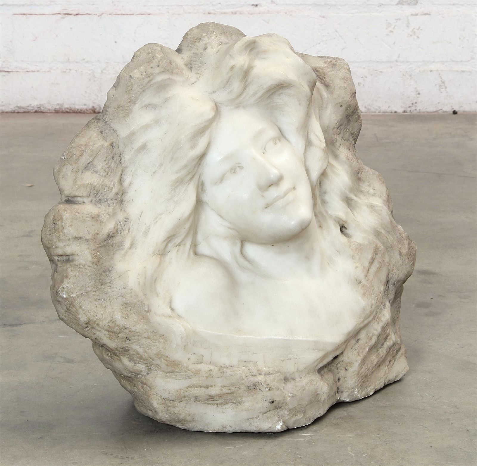 A CONTINENTAL MARBLE RELIEF BUST OF