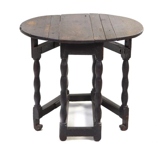 A Continental Oak Drop-Leaf Table