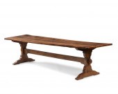 A CONTINENTAL OAK TRESTLE TABL