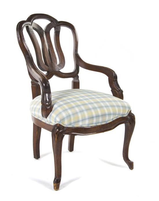 *A Continental Open Armchair having