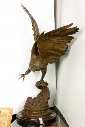 A CONTINENTAL PATINATED BRONZE