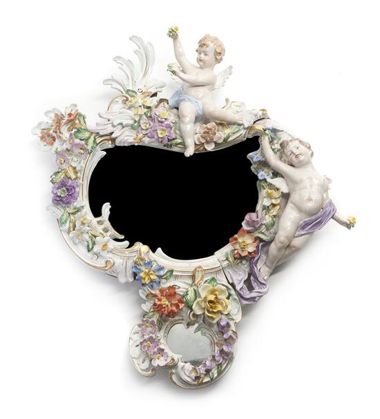 A Continental Porcelain Mirror of