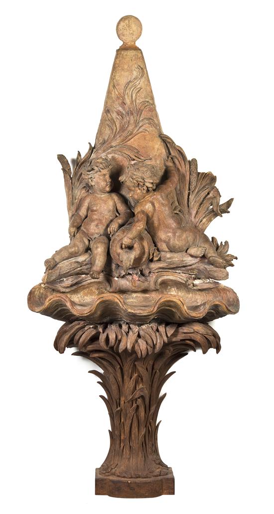 A Continental Terracotta and Carved