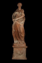 A CONTINENTAL TERRACOTTA STATU