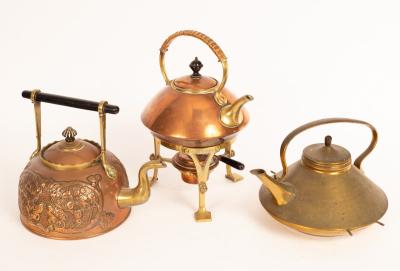 A copper and brass kettle on