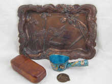 A copper coloured Japanese tray