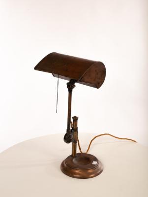 A copper finished metal desk