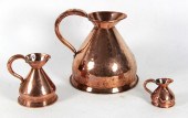 A copper gallon rum jug on a s