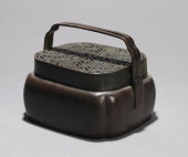 A COPPER HANDWARMER<br>A COPPE
