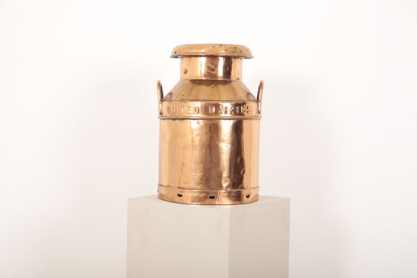 A COPPER MILK CHURN of