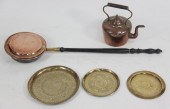 A copper warming pan with turn