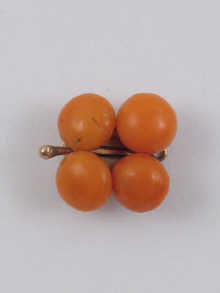 A coral and gold three row necklace