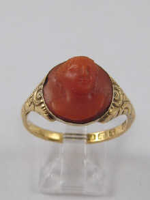 A coral cameo ring set in 18 ct