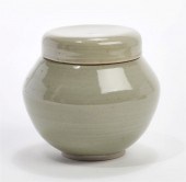 A COVERED GREEN CERAMIC VESSEL