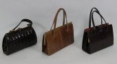 A crocodile skin handbag anoth