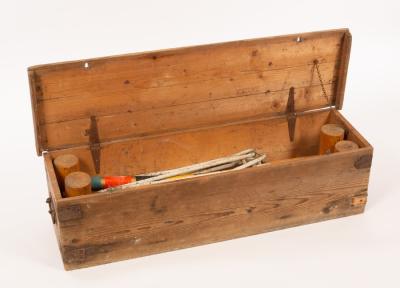 A croquet set in a wooden case,