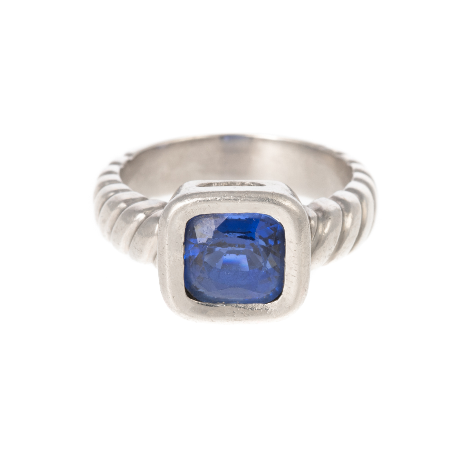 A CUSHION-CUT SAPPHIRE RING IN