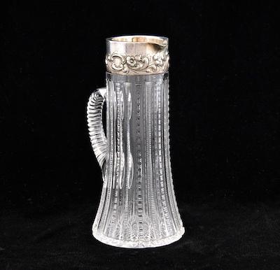 A Cut Crystal Pitcher with Repousse