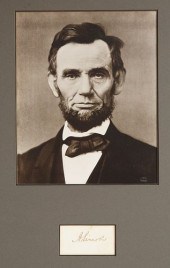 A CUT SIGNATURE AND PHOTOGRAPH