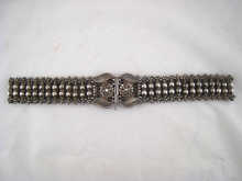 A cut steel belt and buckle approx.
