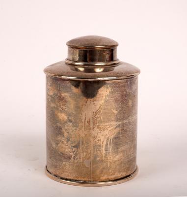 A cylindrical silver tea caddy,