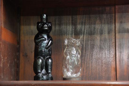 A DARK AMBER GLASS BEAR FIGURAL