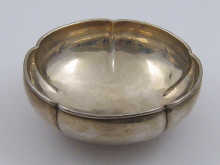 A deeply lobed Arts & Crafts silver