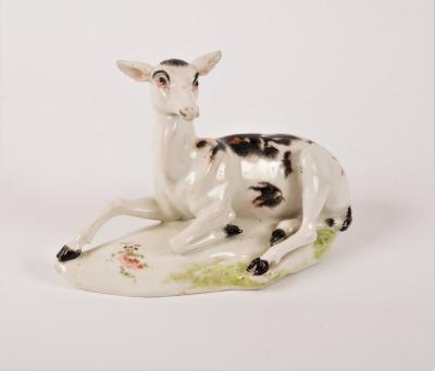 A Derby figure of a recumbent