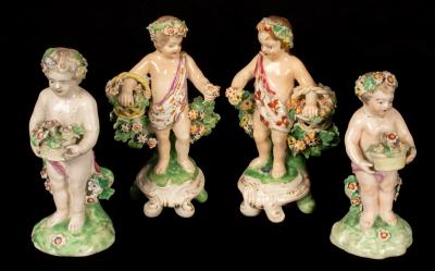 A Derby pair of cherubs with flower