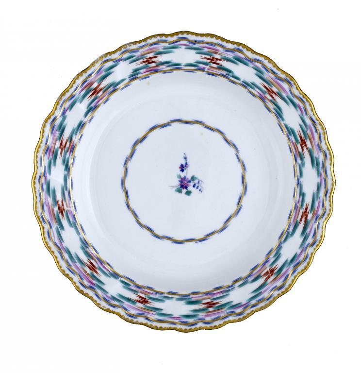 A DERBY PLATE enamelled with the