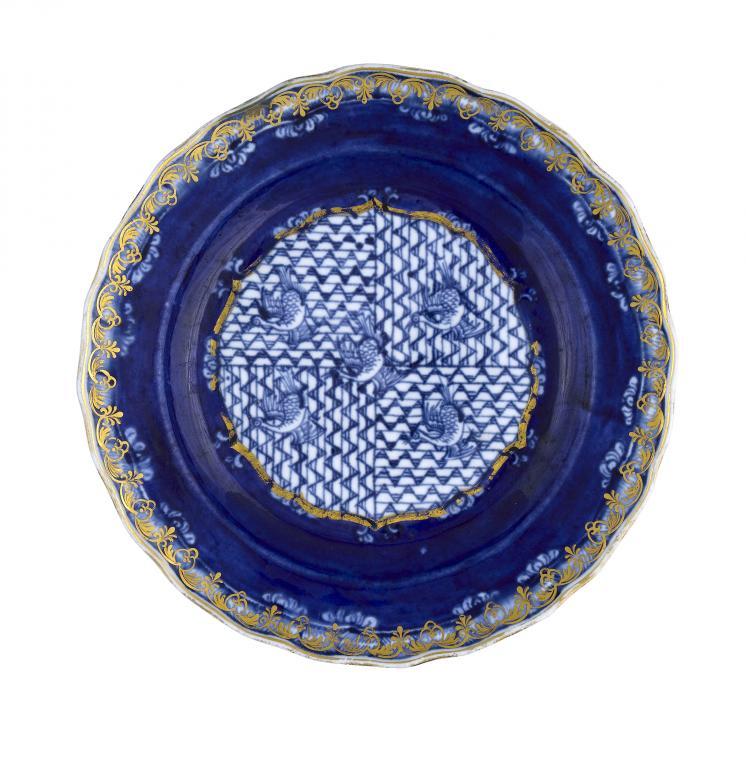 A DERBY PLATE painted in underglaze