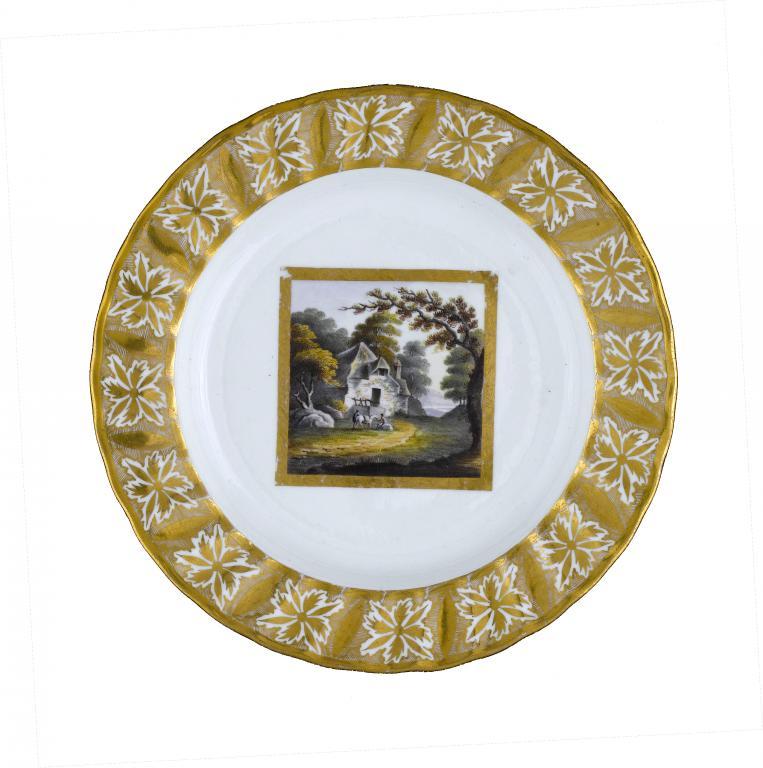 A DERBY PLATE  painted with rustics
