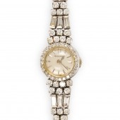 A DIAMOND AND FOURTEEN KARAT W